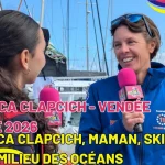 Francesca Clapcich, skipper engagée sur la Vendée Arctique 2026, répond aux questions d’une jeune reporter de Media Pitchounes sur les pontons avant le départ de la course.